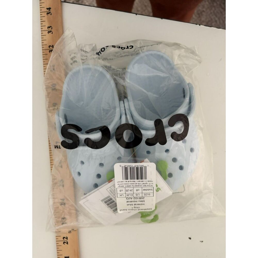 Kids Size 8C crocs Blue with pastel stars and flowers